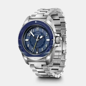 Reloj suizo automático Journey 1884 con bisel cerámico, caja de acero inoxidable y brazalete plateado.